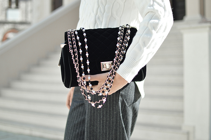 A person holding a luxury purs.