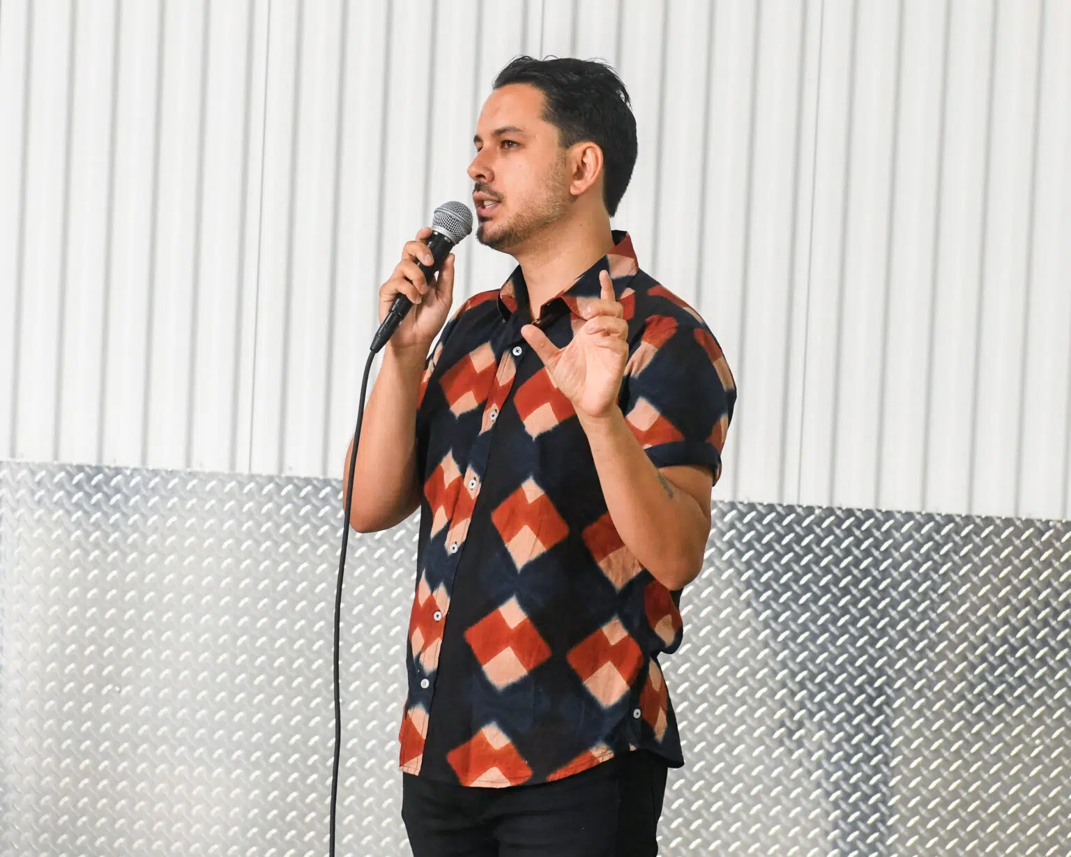Fourth Annual UOVO Prize winner Suneil Sanzgiri discussing his mural at UOVO Brooklyn.