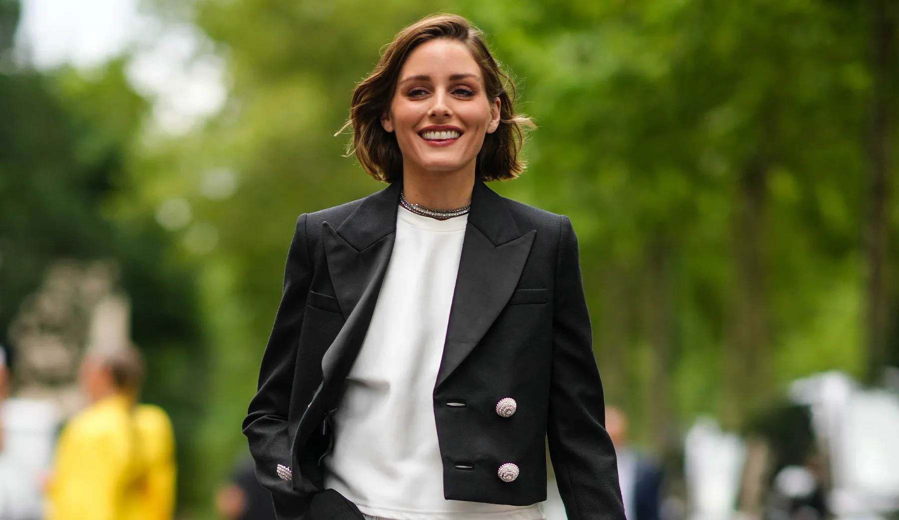 UOVO client Olivia Palermo at 2023 Paris Fashion Week in a white tee and black blazer.