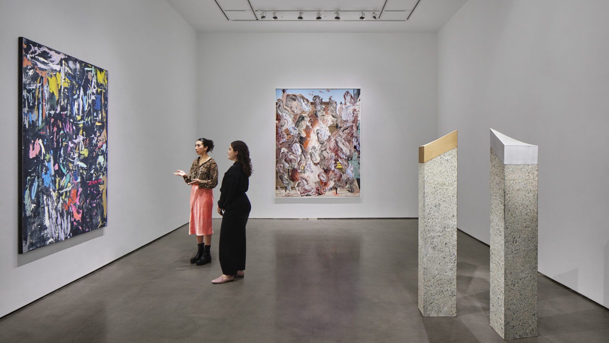 Collectors reviewing artworks in one of UOVO's Long Island City viewing galleries.