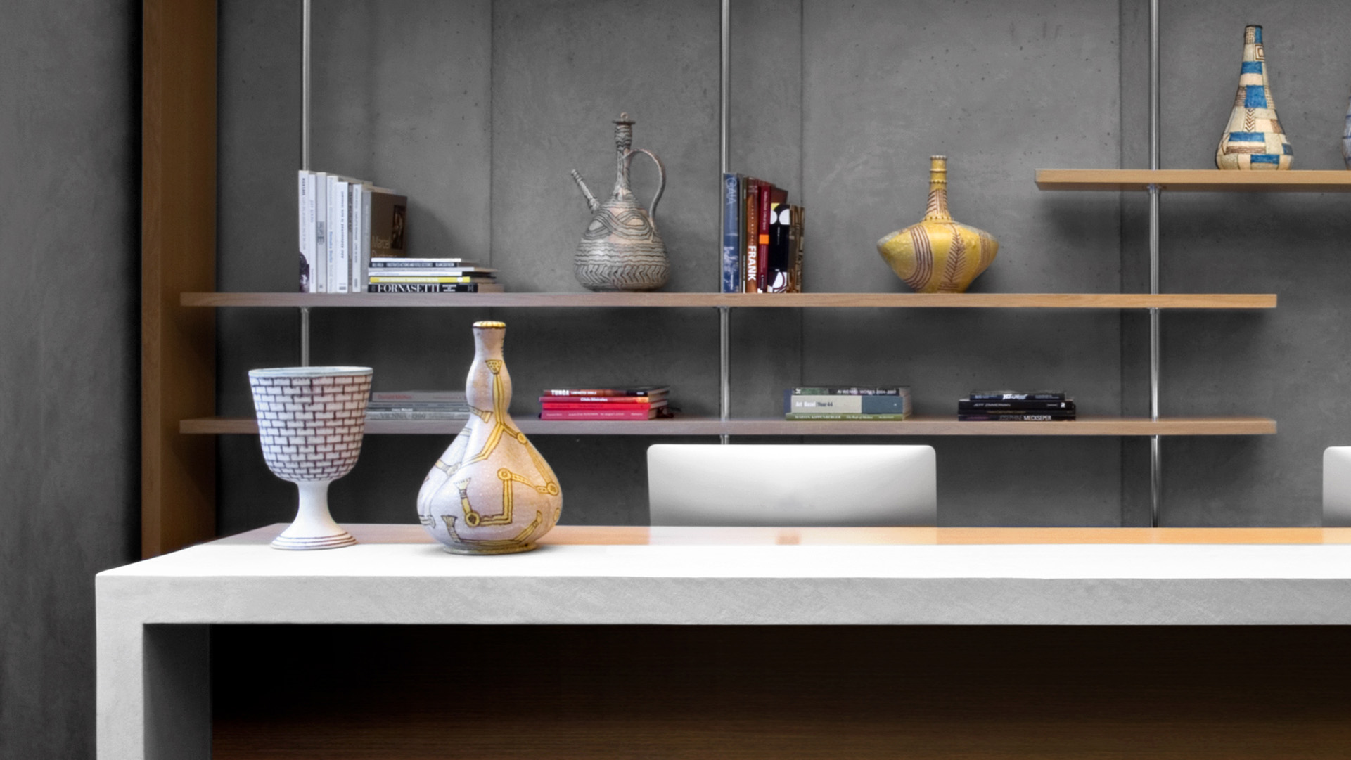 Reception Desk With Sculptures on Shelves
