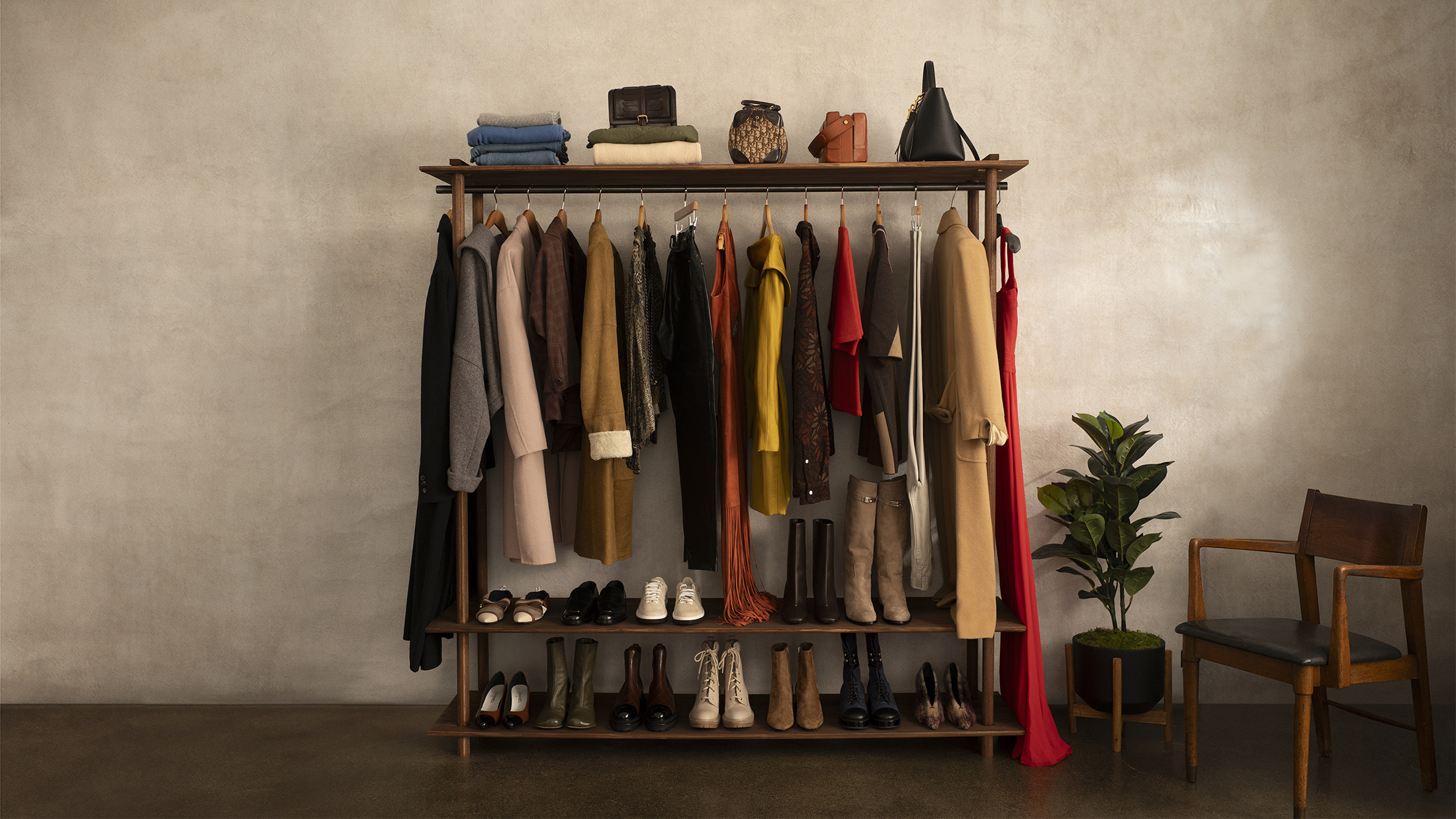 Autumn clothing arranged on a clothing rack, ready to be handled by UOVO Fashion's professional storage service.