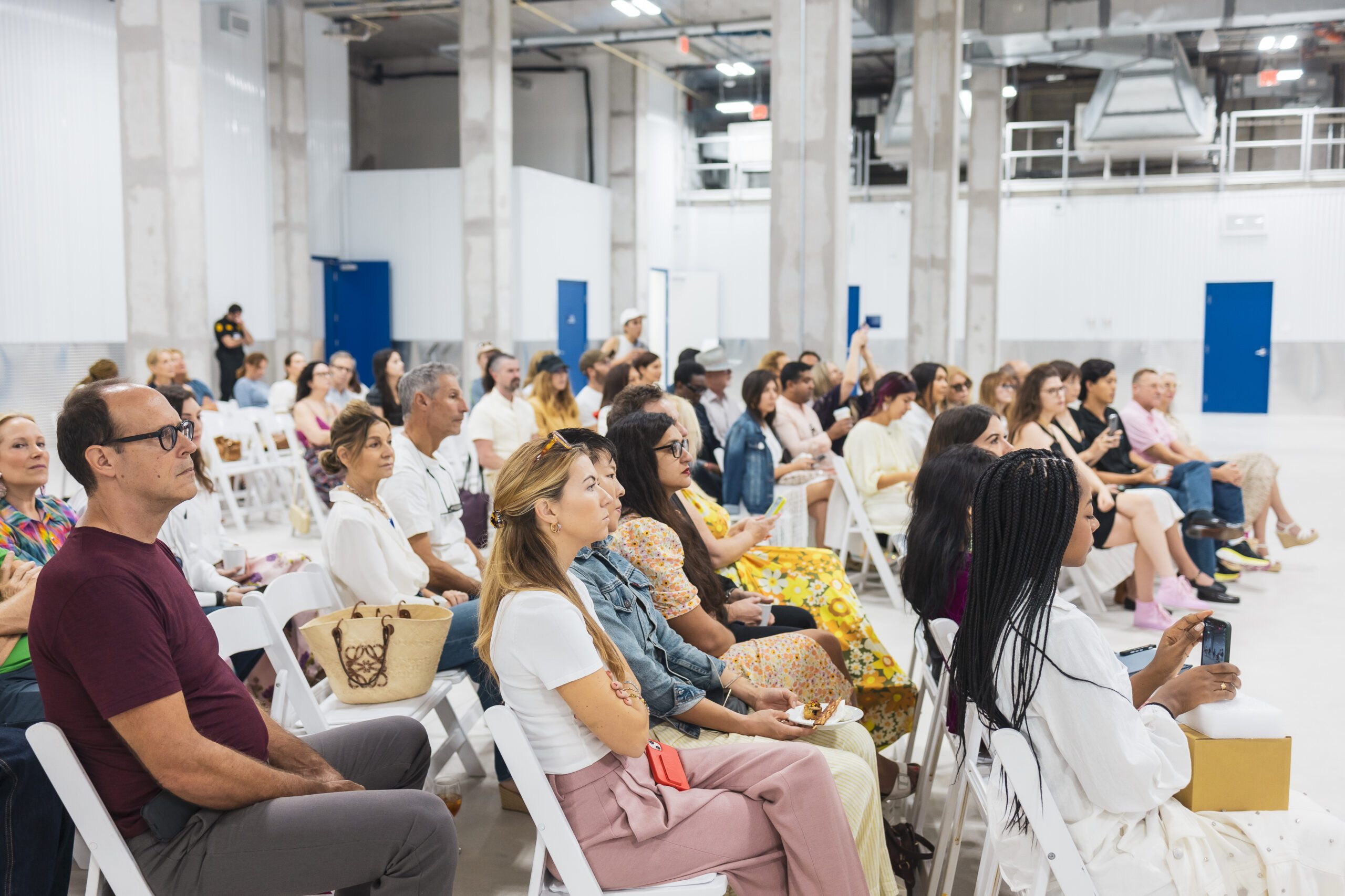 Engaged audience at New Wave Art Wknd's art panel, hosted by UOVO.