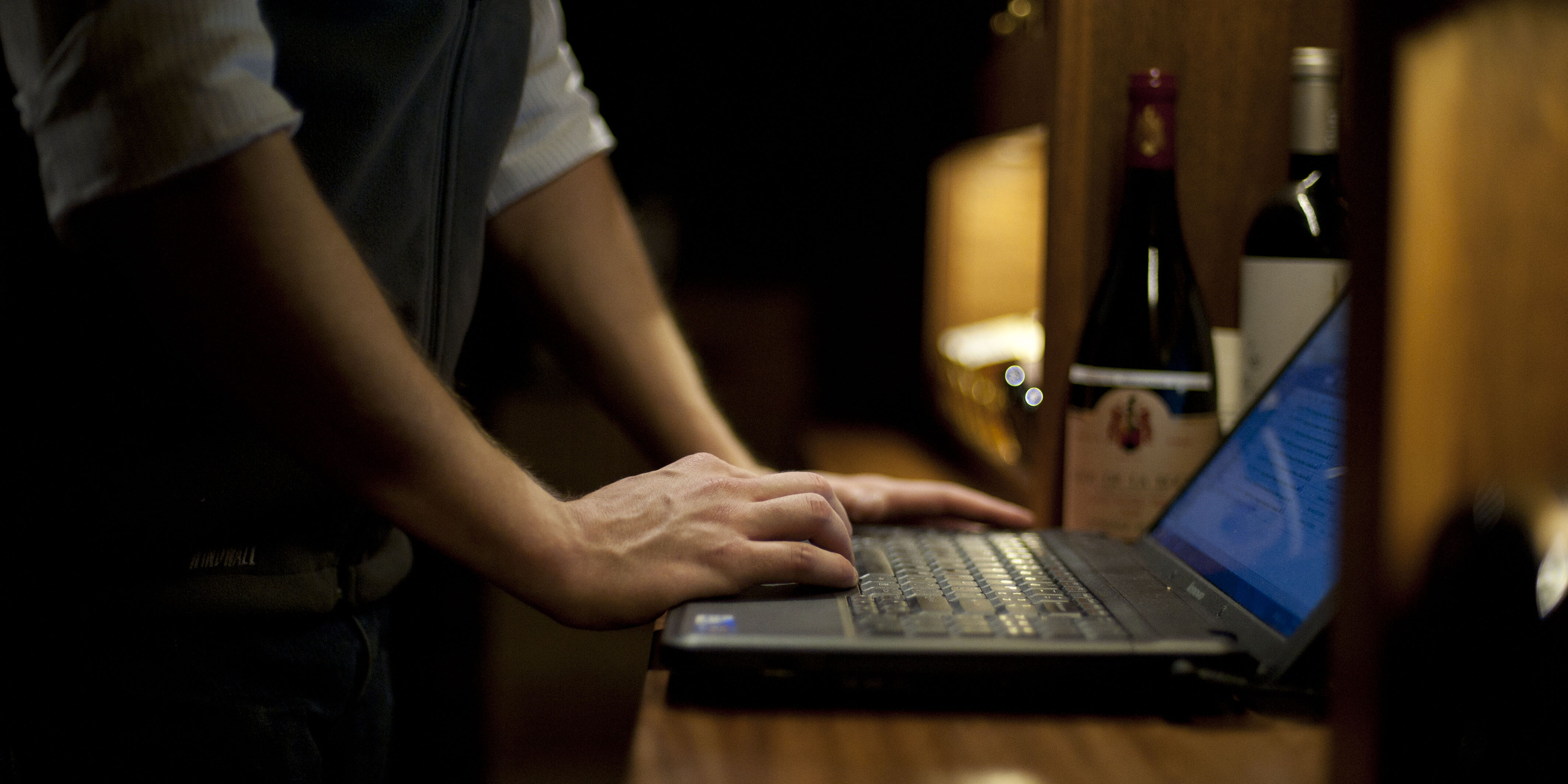 Person on Computer looking at Wine Inventories in UOVO Storage
