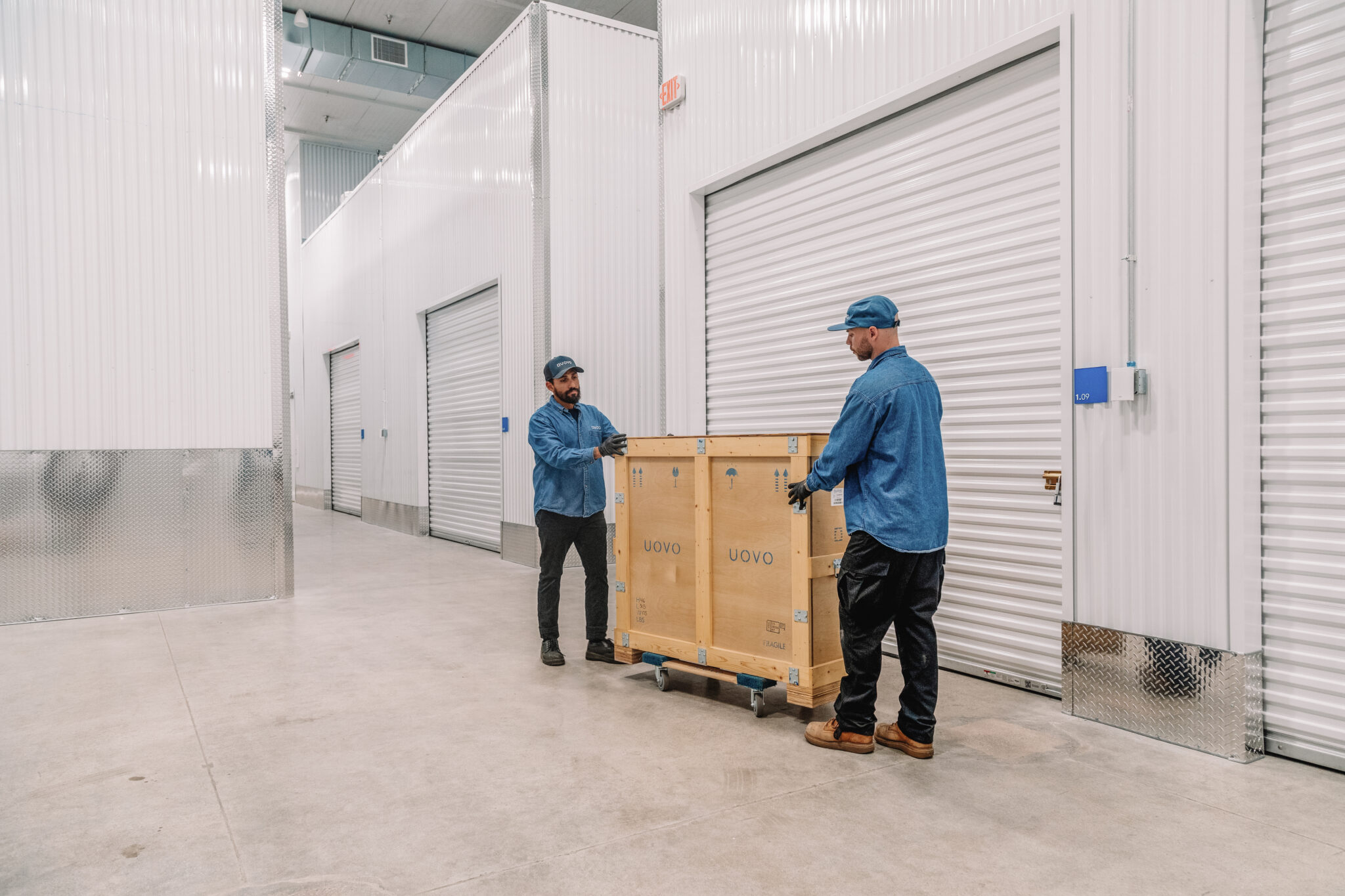 UOVO Staff Transporting Art in Crates at UOVO San Francisco