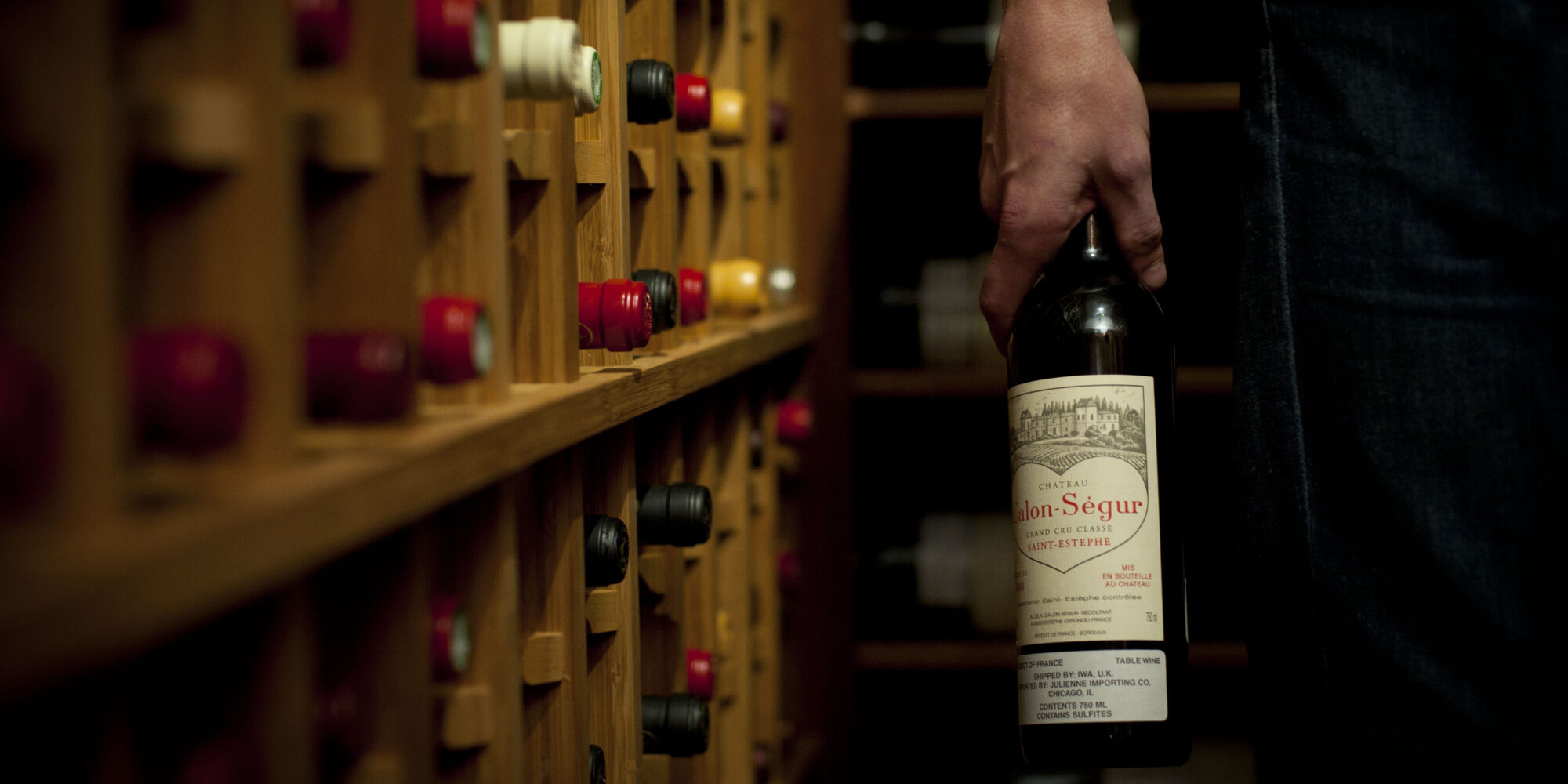 Wine collector in his home cellar.