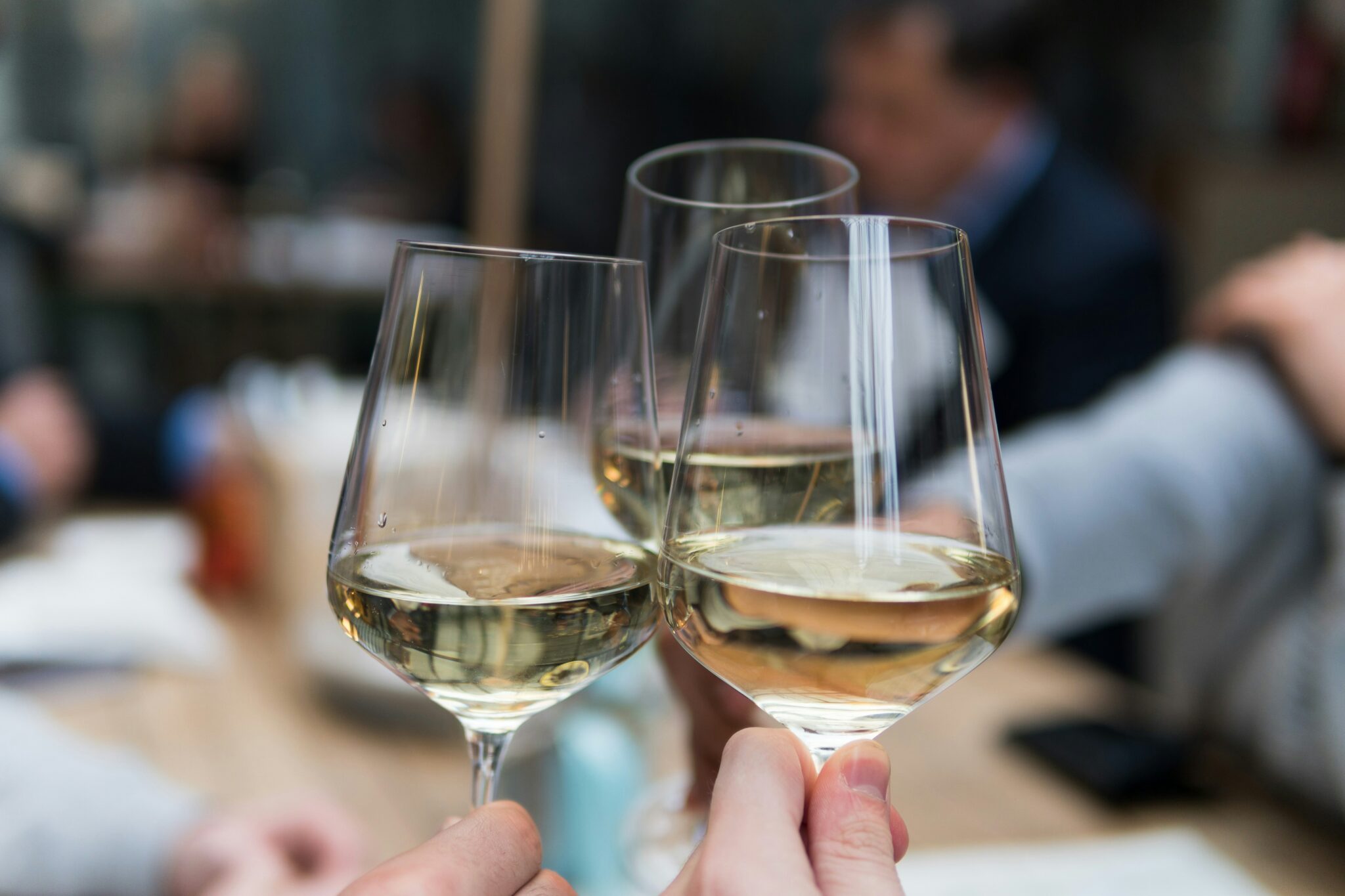 Clients enjoying a glass of wine at UOVO Wine Miami.