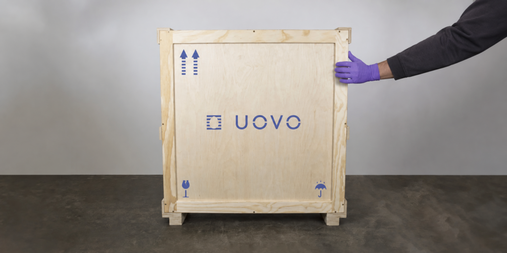 Art handler caring for a UOVO crate.