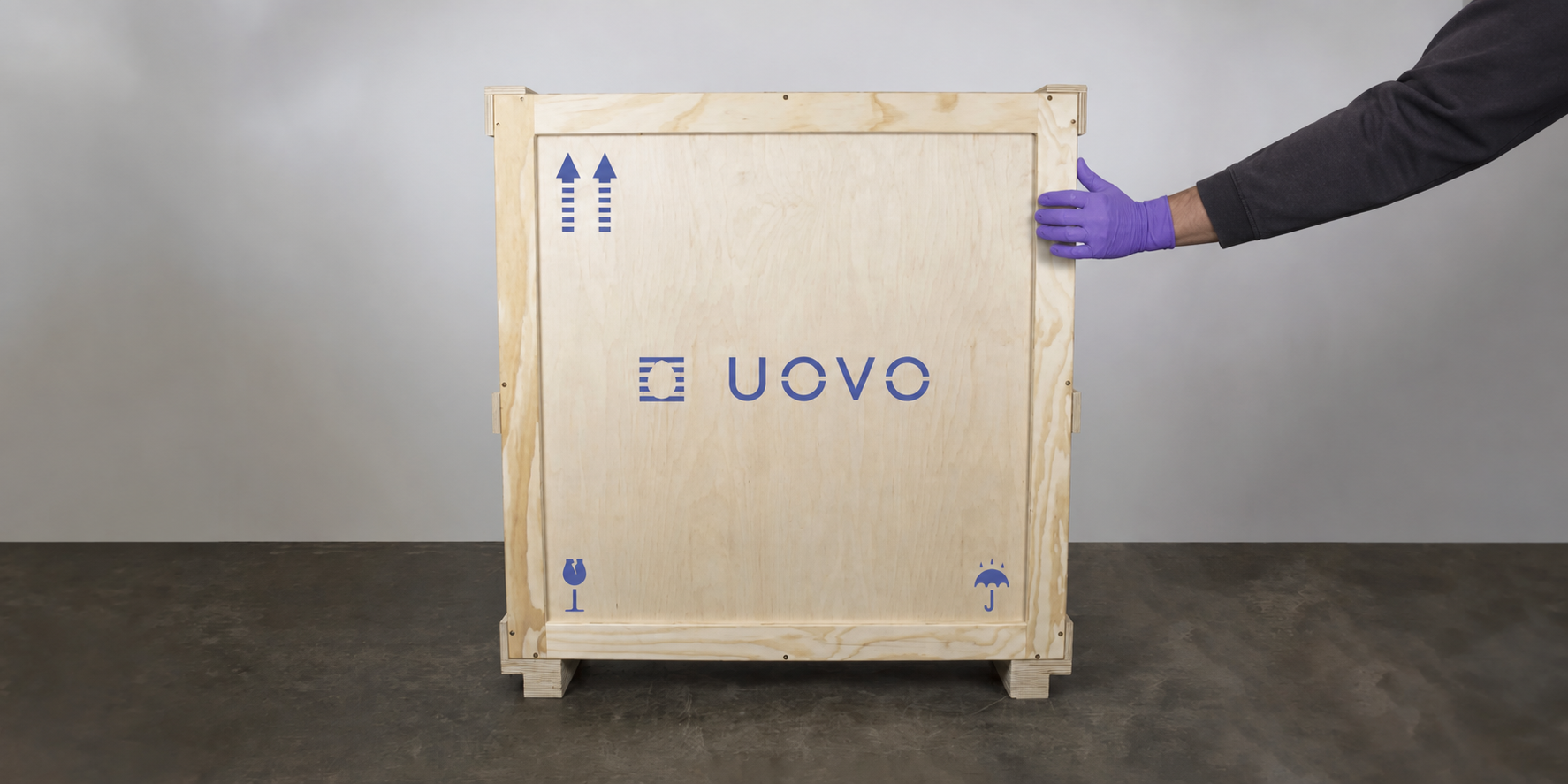Art handler caring for a UOVO crate.